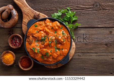 Tasty butter chicken curry dish from Indian cuisine. Royalty-Free Stock Photo #1153329442