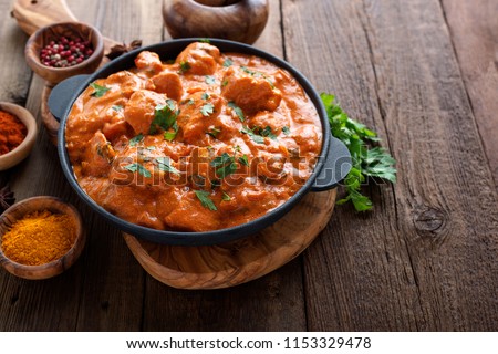 Tasty butter chicken curry dish from Indian cuisine. Royalty-Free Stock Photo #1153329478