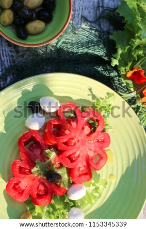 traditional Italian salad of tomatoes and mozzarella
