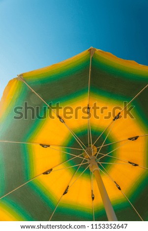 Beach Umbrella shot from Below on a sunny Day with blue Sky