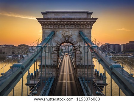 Budapest, Hungary - The world famous Szechenyi Chain Bridge at sunrise Royalty-Free Stock Photo #1153376083