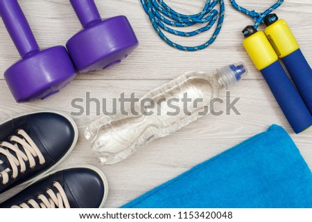 Different tools for fitness on floor in room