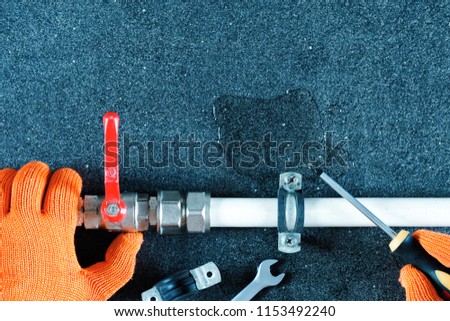 Hands of plumber repair plumbing line with leaks, close up view. Top view with copy space. Royalty-Free Stock Photo #1153492240