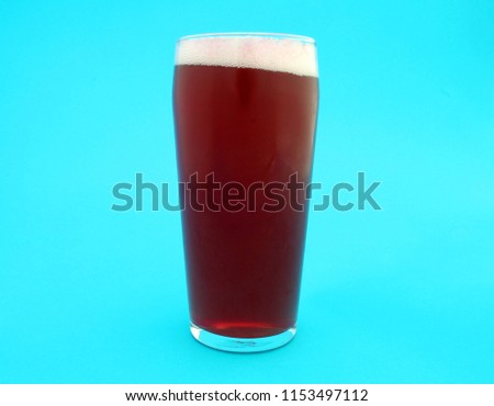 glass of beer wiet raspberry juice