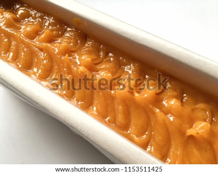 Turmeric natural oil soap in mold box on white background, cold process.
