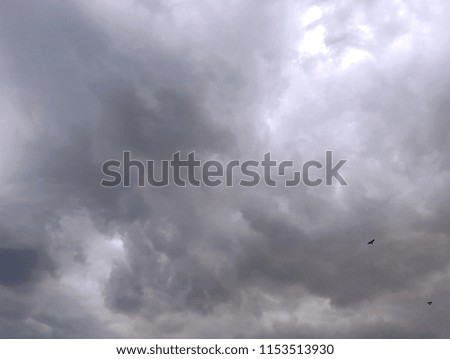 Grey sky landscape with dark clouds and storm coming