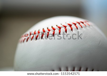 Close up macro photo of the detailed stitching on a baseball
