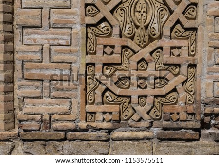 Elements of brick wall with decoration of Uzgen Mausoleum in Osh Region, Kyrgyzstan. Uzgen was one of the capitals of the Karakhanids, who called it Mavarannahr and left three well-preserved mausolea.