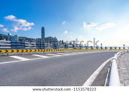 empty asphalt road with city skyline in hong kong china