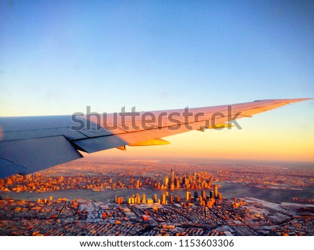 Aerial view of the New York City Manhattan Skyline (USA) from an airplane during sunset / sunrise on a winter day