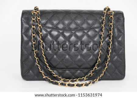 Photo of black leather bag  on white background.