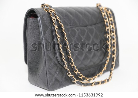 Photo of black leather bag  on white background.