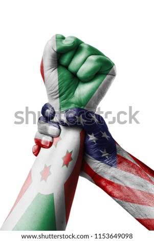AMERICAN VS Burundi,  Fist painted in colors of Burundi flag, fist flag, country of Burundi 