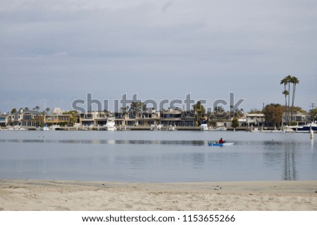 Scenic harbor marina waterfront in San Diego - California (USA) with sail boats and luxury vacation estates