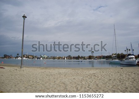 Scenic harbor marina waterfront in San Diego - California (USA) with sail boats and luxury vacation estates