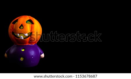 halloween decoration little pumpkin head rgb lighted with black background
