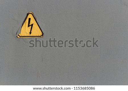 Electrical safety sign on a gray background