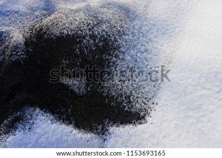 black and white texture of cold snow and ash