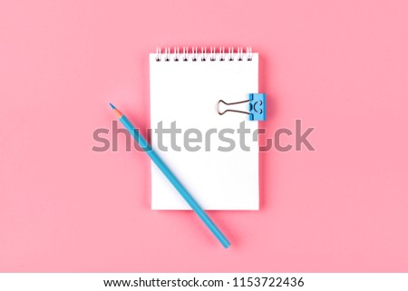 Top view of Blank notebook with peb on colorful background pink with copy space.