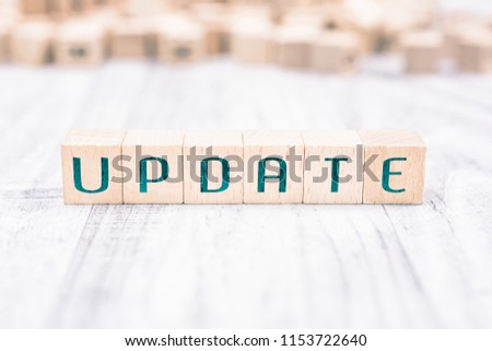 The Word Update Formed By Wooden Blocks On A White Table, Reminder Concept Royalty-Free Stock Photo #1153722640