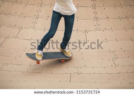 Skateboarder on skatepark ramp
