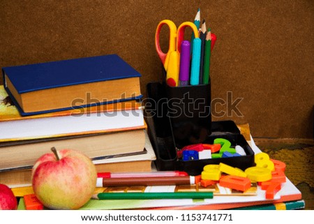 Preparation for school. School supplies on the table