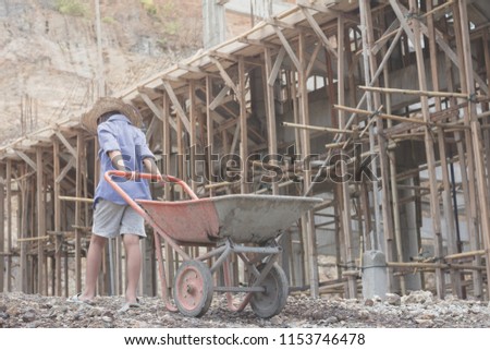 Children are forced to work construction., World Day Against Child Labour concept. Royalty-Free Stock Photo #1153746478