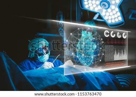 Doctor with virtual reality in operation room in hospital.Surgeon analyzing patient heart testing result and human anatomy on technological digital futuristic virtual interface,digital holographic. Royalty-Free Stock Photo #1153763470