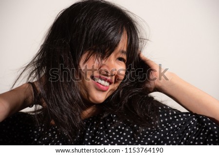 Beauty portrait of asian woman in a black and white polka dot shirt and blue jeans dot shirt