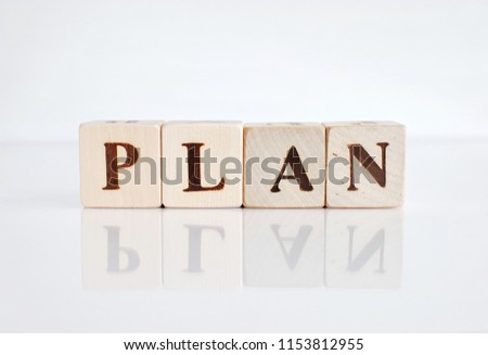 Word PLAN on wooden building blocks.