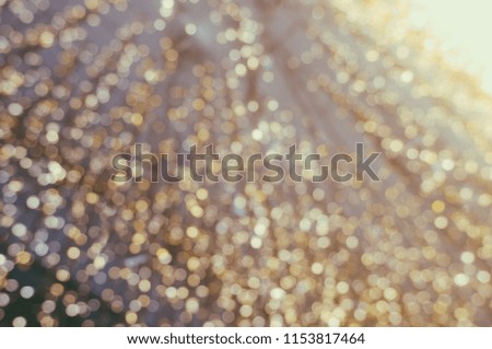 Abstract yellow bokeh circles for Christmas background. Royalty high-quality free stock photo of Christmas light overlay background. Holiday glowing backdrop. Defocused background with blinking stars