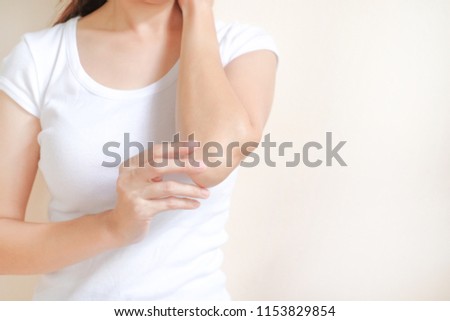 Woman applying elbow cream,lotion , Hygiene skin body care concept. Royalty-Free Stock Photo #1153829854
