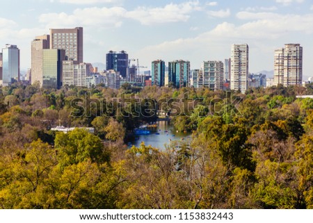Skyline of city centre of Mexico City, Mexico with Lake and woods of Chapultepec in the foreground Royalty-Free Stock Photo #1153832443