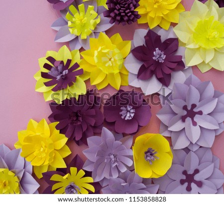 Paper craft Flower Decoration Concept. Flowers and leaves made of paper. Tropics. Pink background.