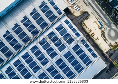aerial view of factory roof with solar panels