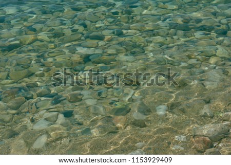 Sea pebble and water
