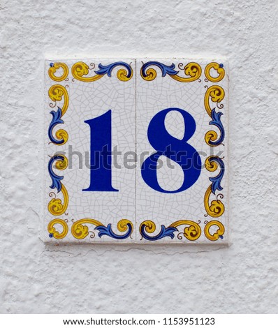 ceramics house number on the wall eighteen