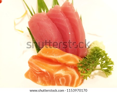 Sasimi, a Japanese dish of bite-sized pieces of raw fish eaten 