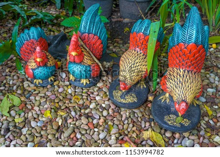 The four clay dolls are colorful hens.