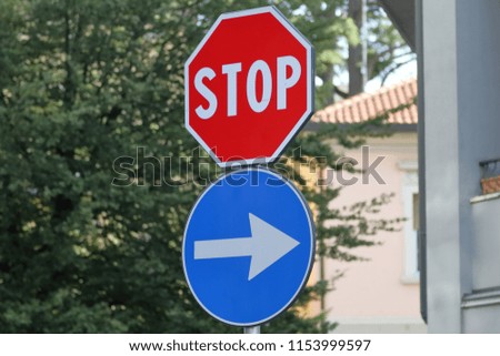 signs indicating stop and direction