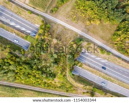 Aerial view of wildlife overpass over highway in Switzerland dur Royalty-Free Stock Photo #1154003344