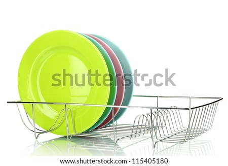 Color plates in rack isolated on white Royalty-Free Stock Photo #115405180