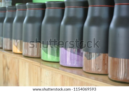 A colorful bottle in a cafe