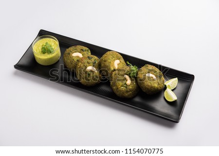Hara bhara Kabab or Kebab is Indian vegetarian snack recipe made using spinach, potatoes and green peas and spices, selective focus Royalty-Free Stock Photo #1154070775