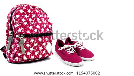 Colored backpack andsneakers,on a white background
