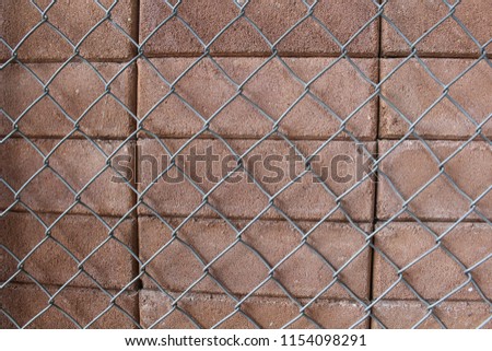 Wire mesh and the brick wall.