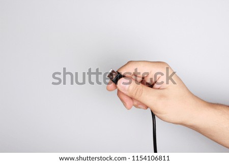 black wire usb in hand