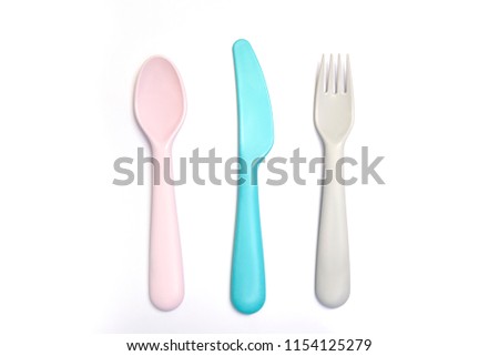 Colorful spoons on white background
