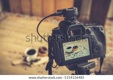 Food photography, DSLR camera on tripod shooting food in photo studio.