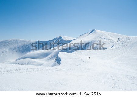 Winter snow covered mountain peaks in Europe. Great place for winter sports Royalty-Free Stock Photo #115417516